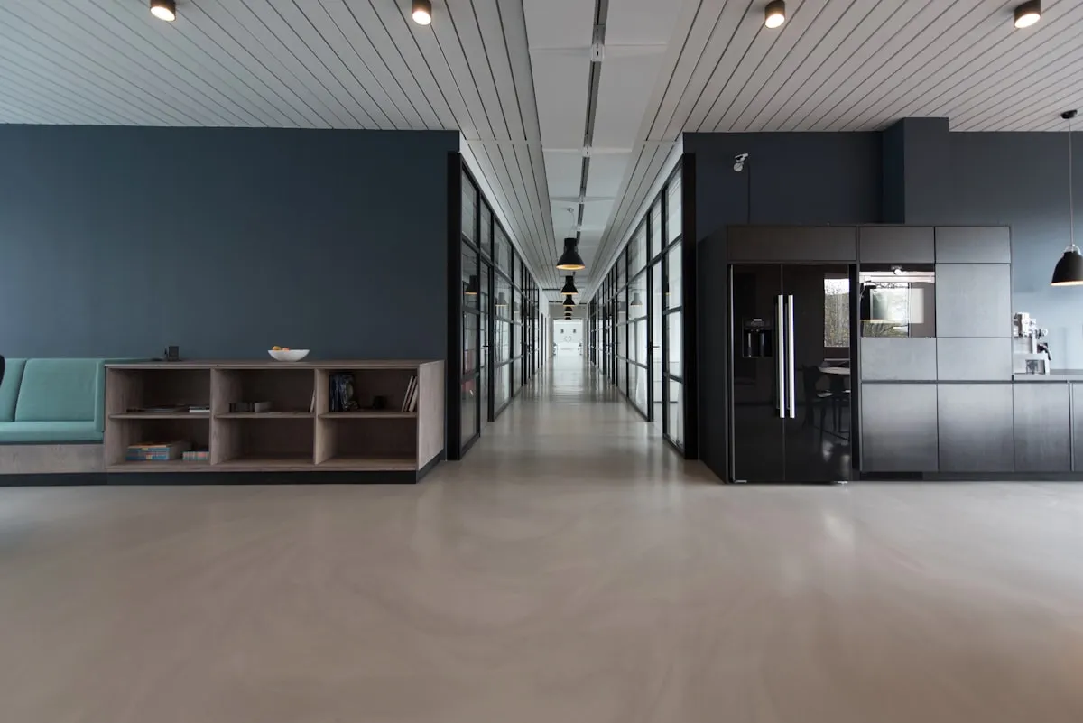 Creative web design studio workspace in London with designers collaborating on screen layouts.