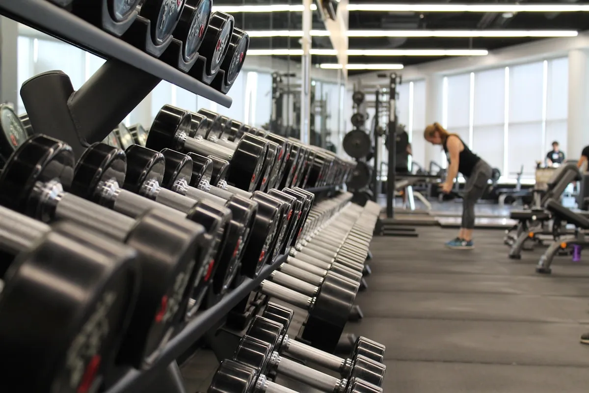 Modern London gym interior with professional weights equipment and clean lighting