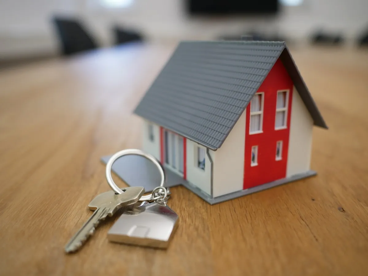 London estate agent office displaying premium property listings on digital screens.